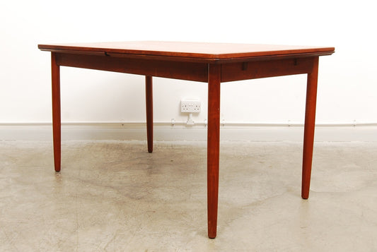 Large extending dining table in teak