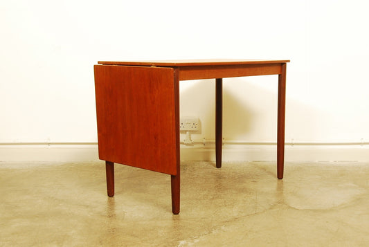 Narrow teak table with leaf