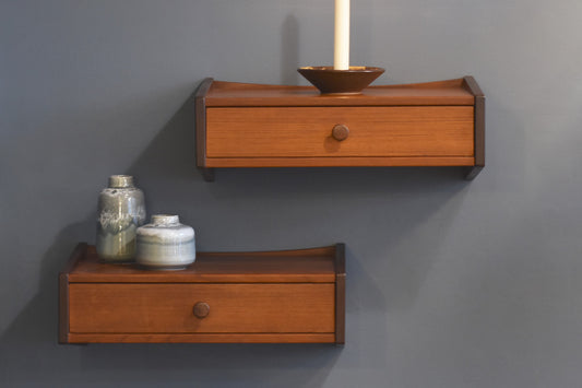 Pair of wall-mounted floating shelves in teak