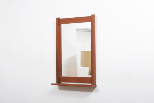 Mirror with shelf