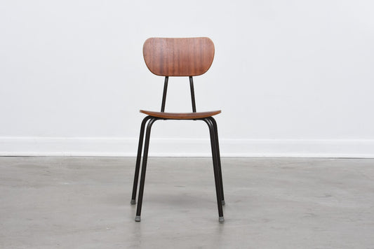 One left: Teak + metal stacking chairs