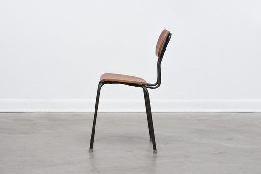 One left: Teak + metal stacking chairs