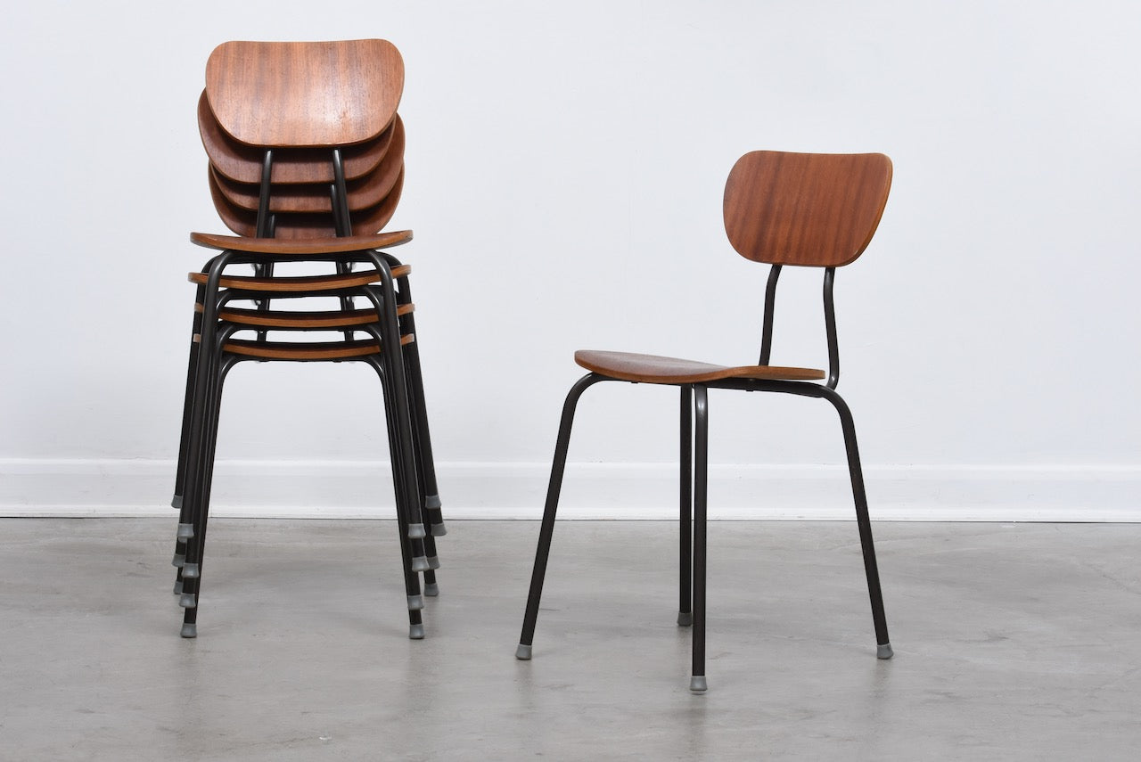 One left: Teak + metal stacking chairs