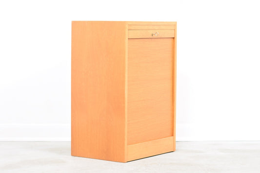 Low oak filing cabinet with tambour door