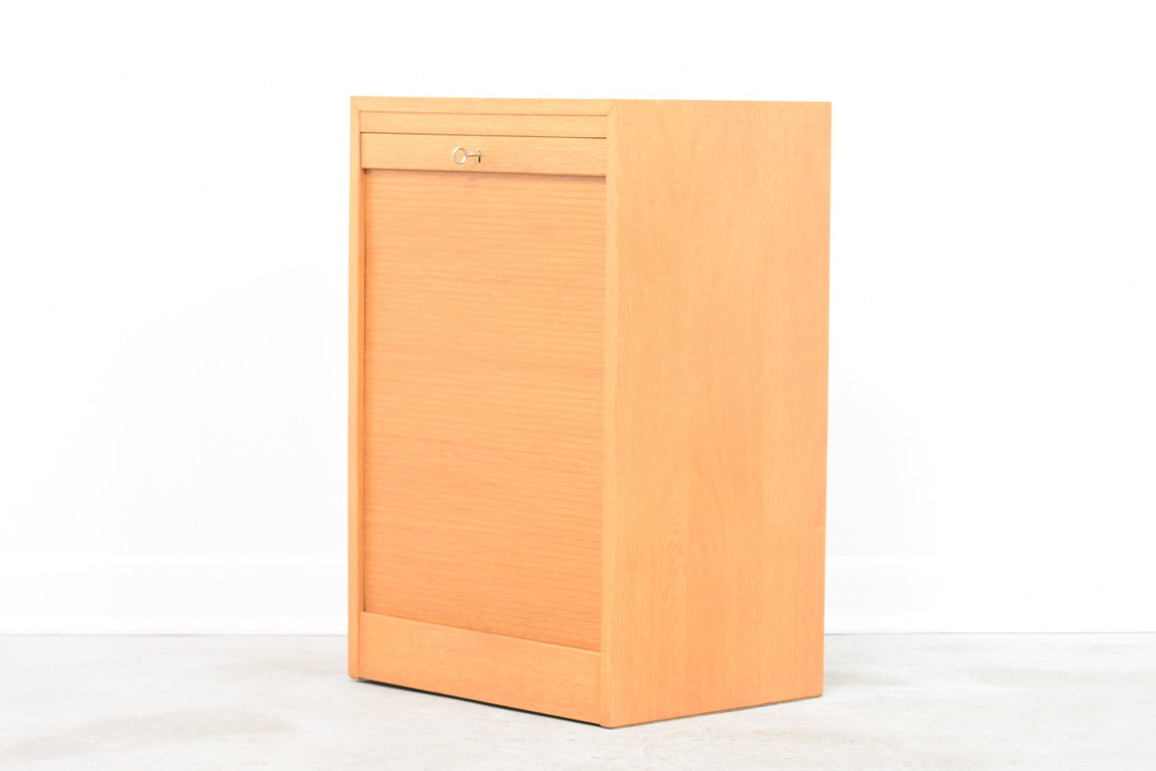 Low oak filing cabinet with tambour door