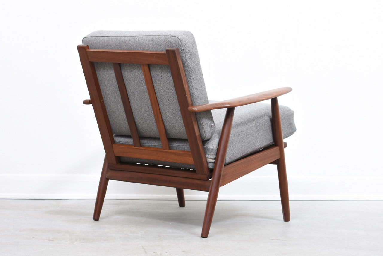 Teak lounger with lead grey cushions