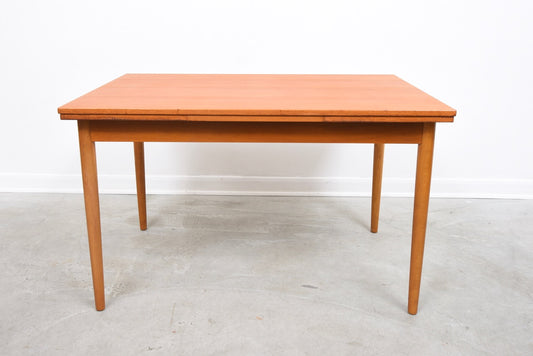 Extending rectangular dining table in teak