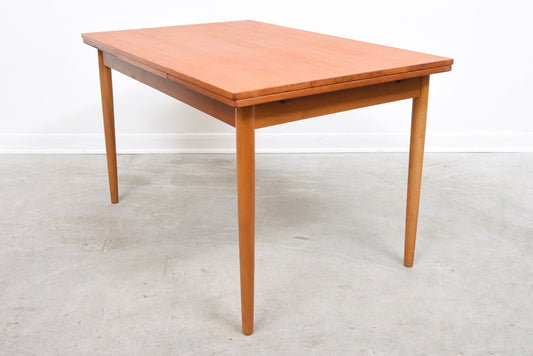 Extending rectangular dining table in teak