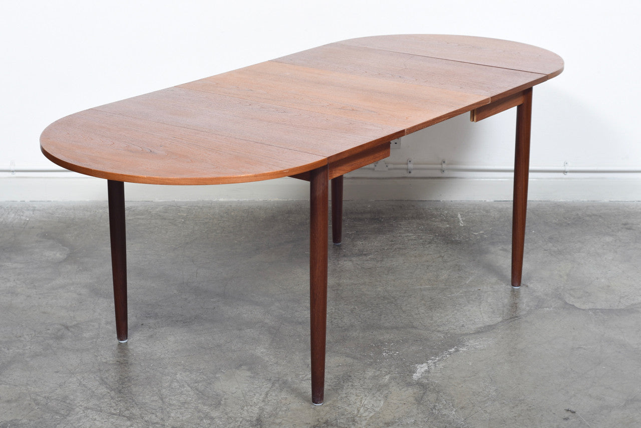 Extending square dining table in teak