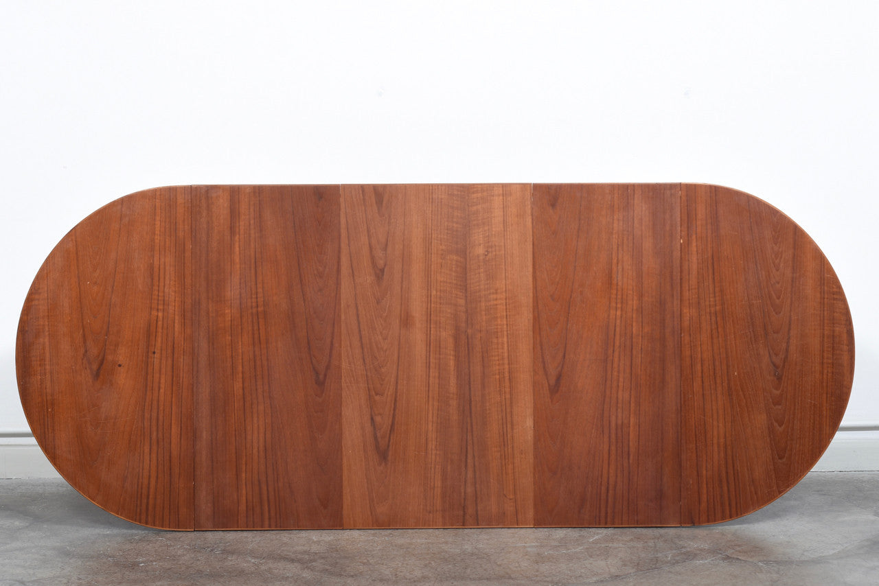 Extending square dining table in teak