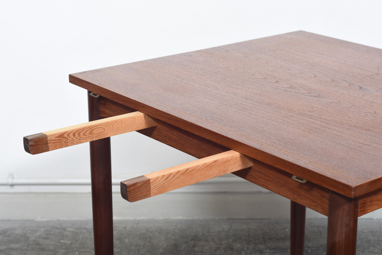 Extending square dining table in teak