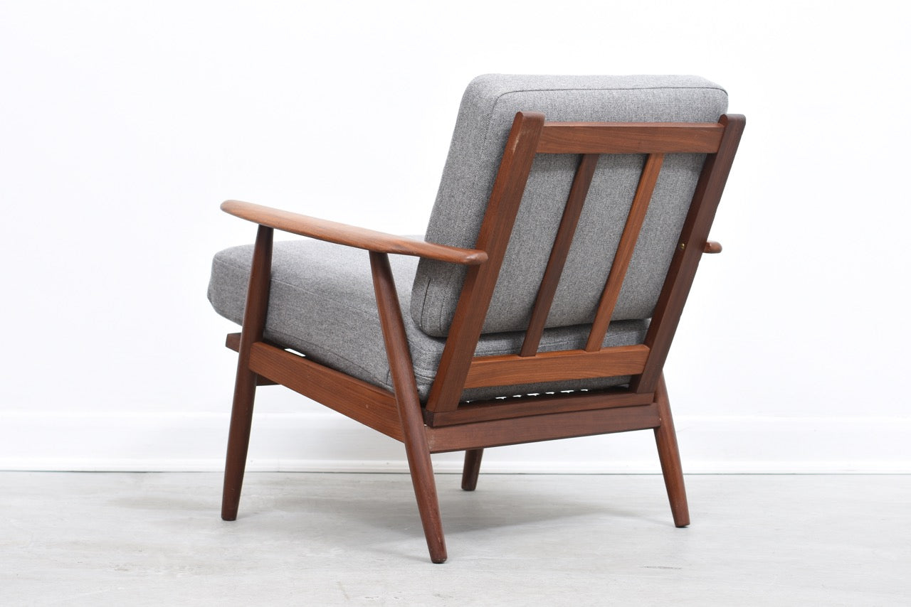 Teak lounger with lead grey cushions