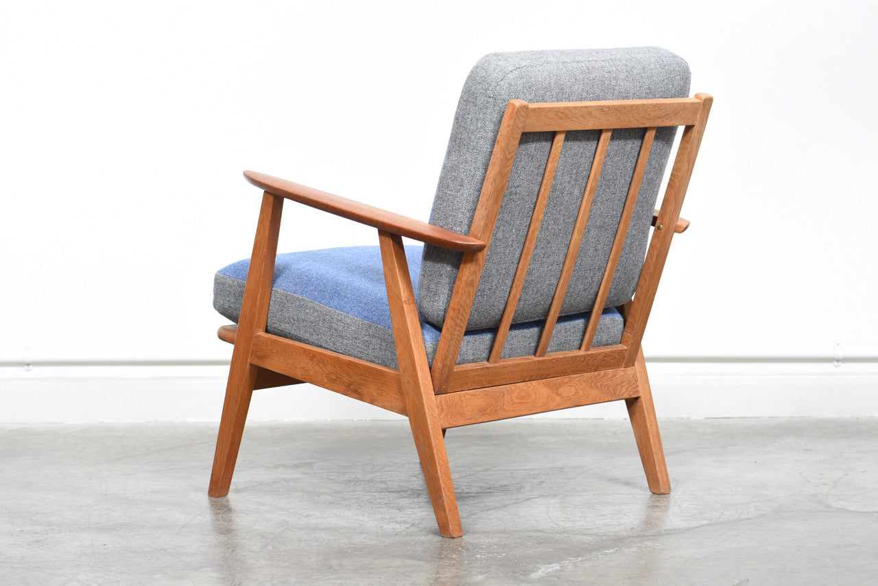 Teak and oak lounge chair with reversible cushions