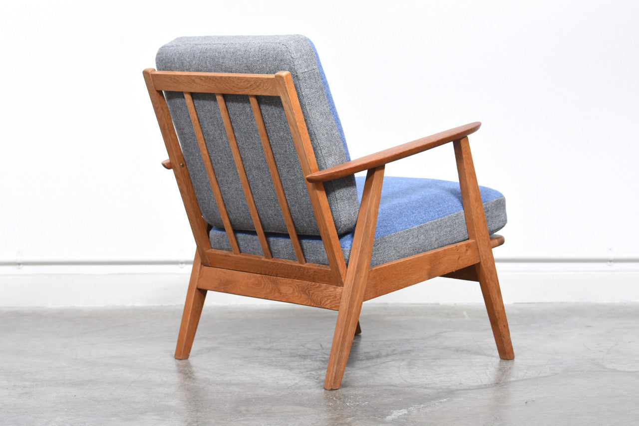 Teak and oak lounge chair with reversible cushions