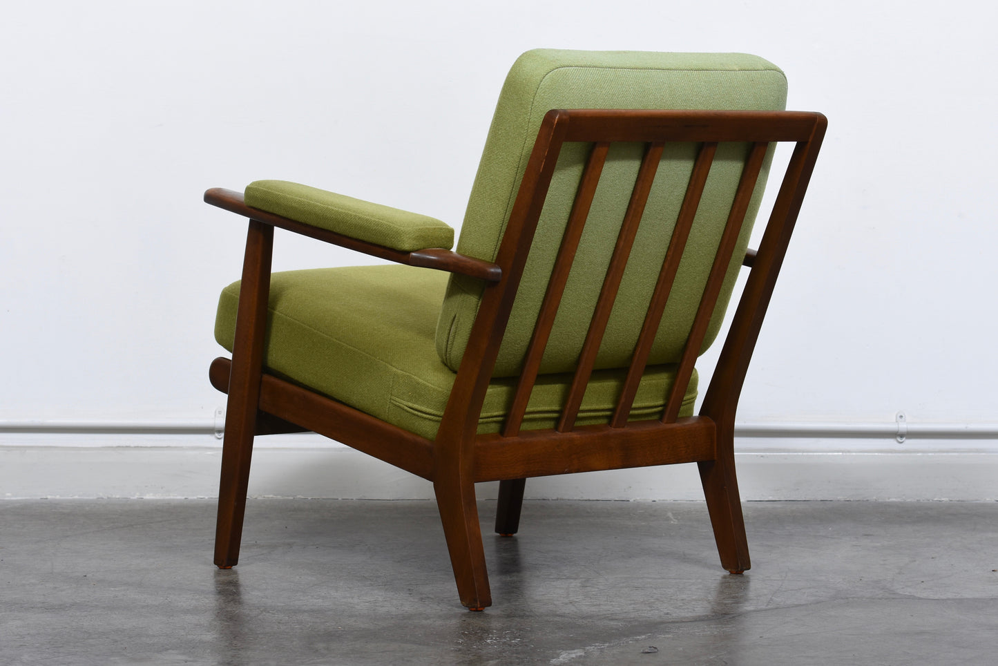 Two available: 1950s loungers with grass green wool cushions