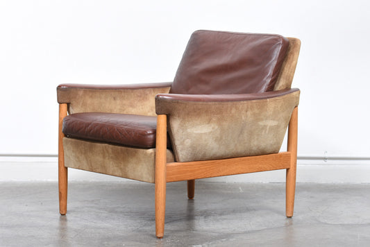 Suede, leather + oak lounger by Kurt Østervig