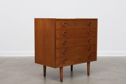 Short teak chest of five drawers