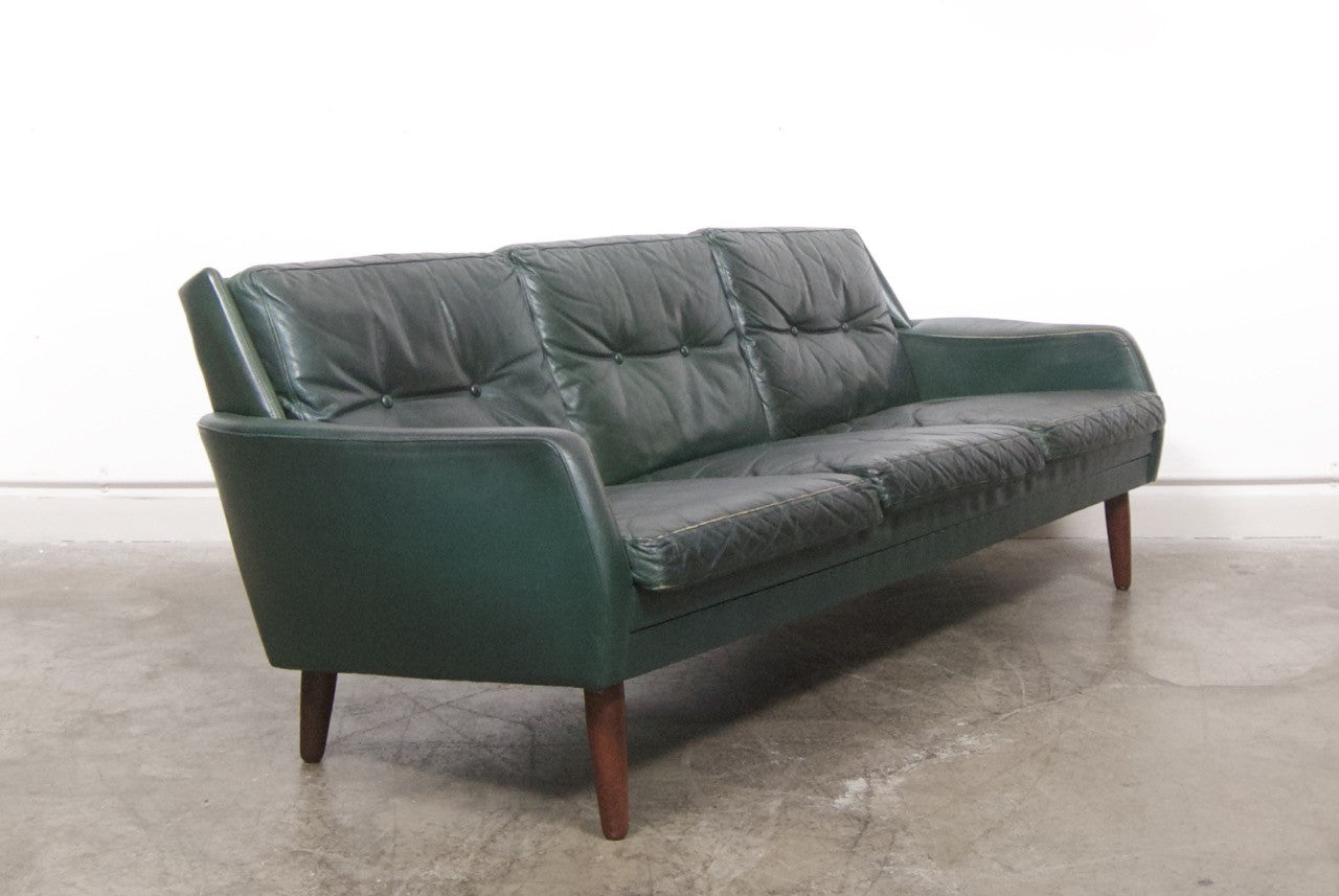Dark green leather sofa