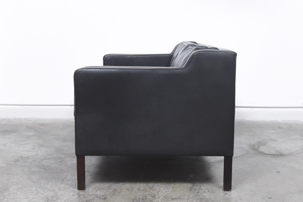 Black leather two seater by Stouby