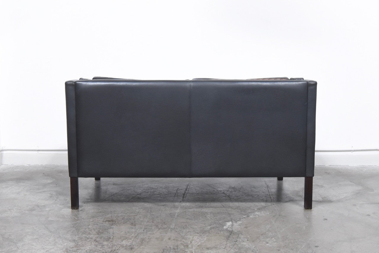 Black leather two seater by Stouby