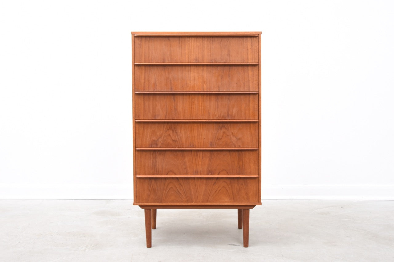 Narrow teak chest of six drawers