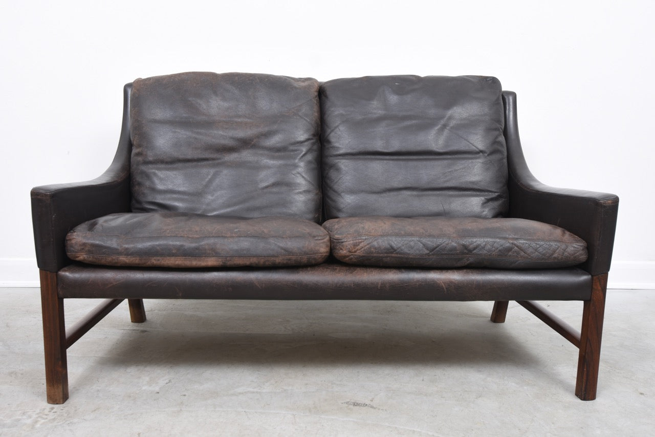 1960s two seat leather sofa on rosewood legs