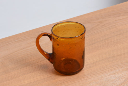 Amber glass mug by Erik Hoglund