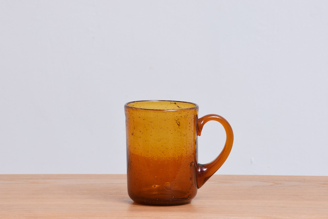 Amber glass mug by Erik Hoglund