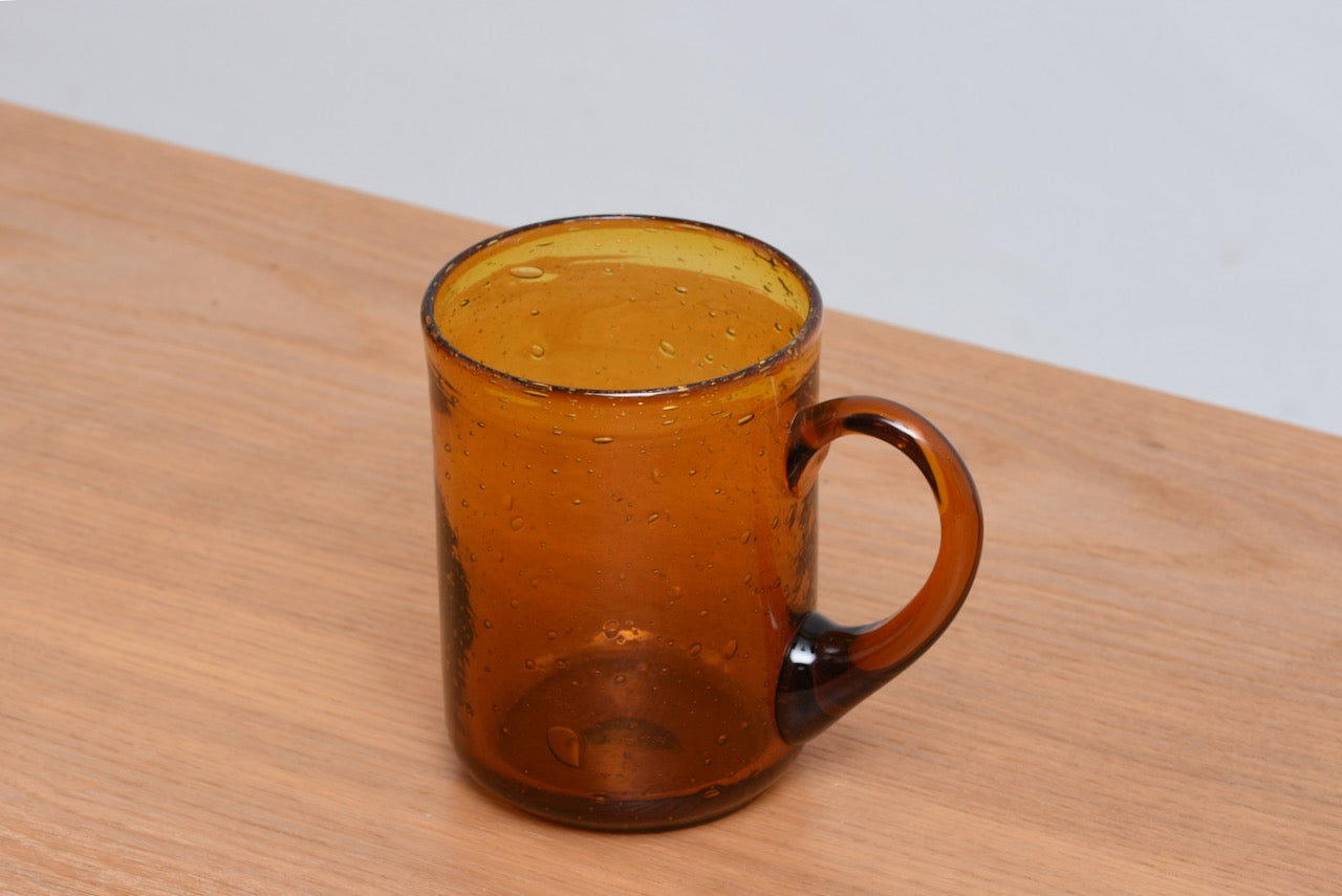 Amber glass mug by Erik Hoglund