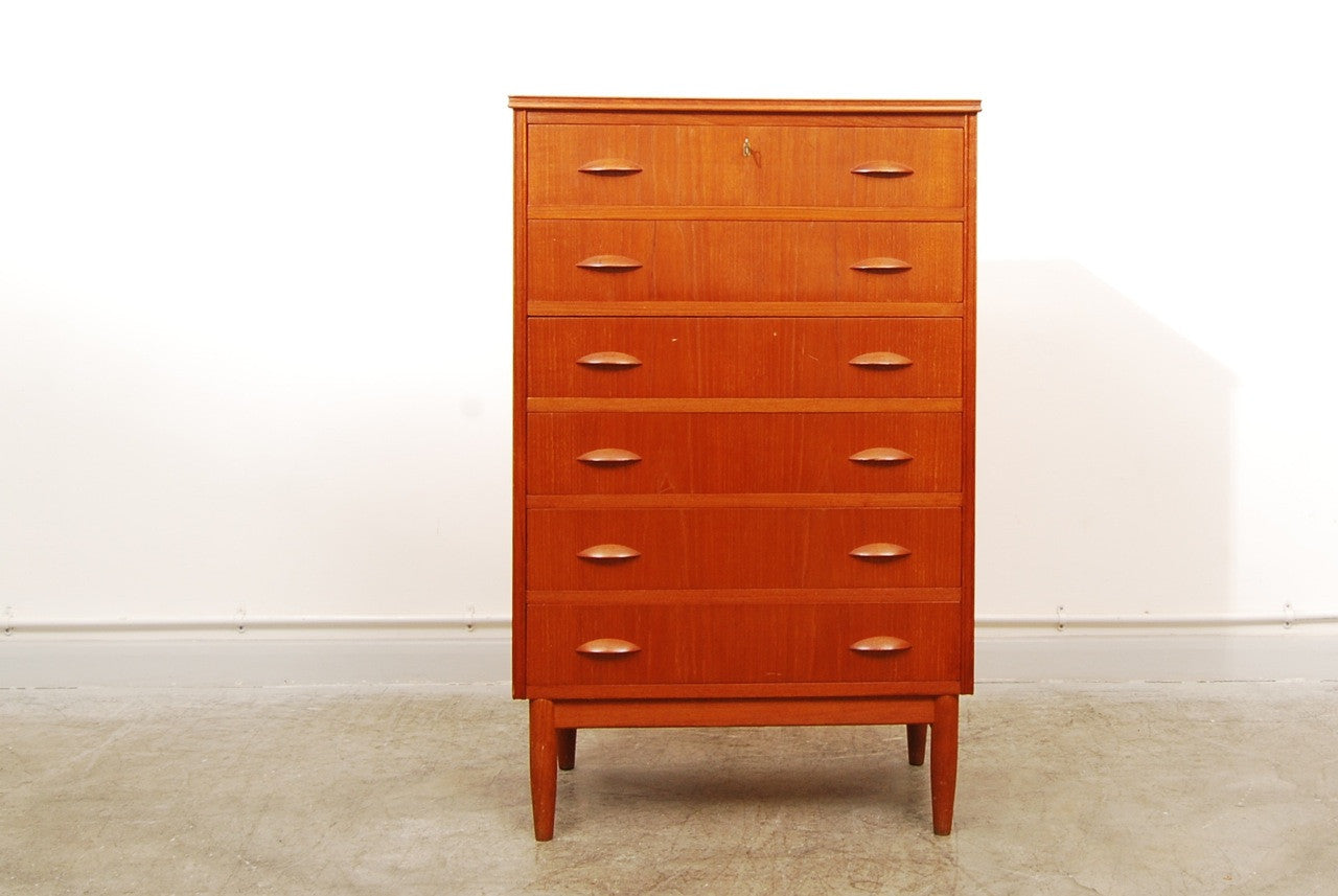 Teak chest of six drawers on oak base