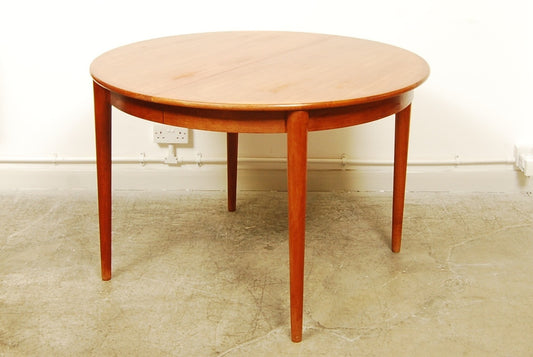 Round teak dining table