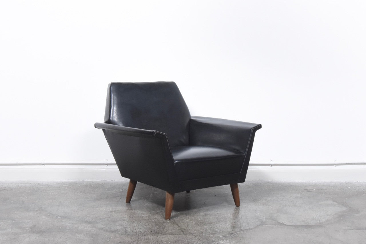Black skai lounge chair on teak legs