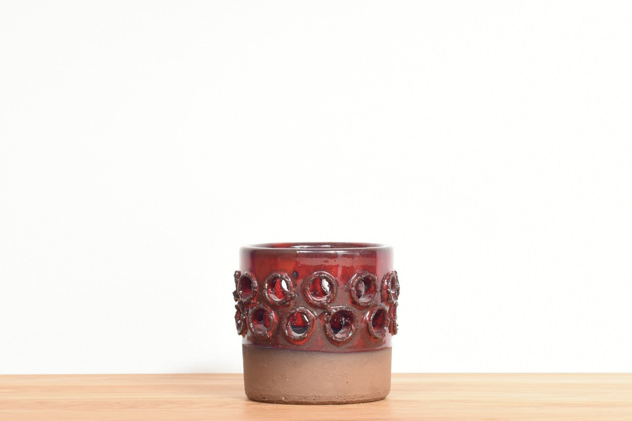 Stoneware candle holder with red glaze