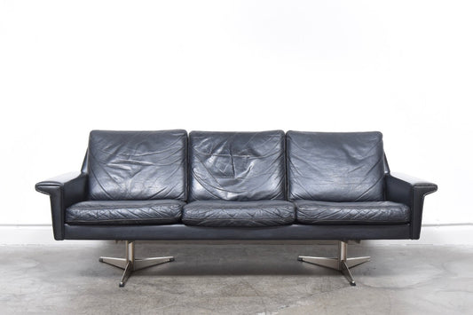 Black leather three seat sofa