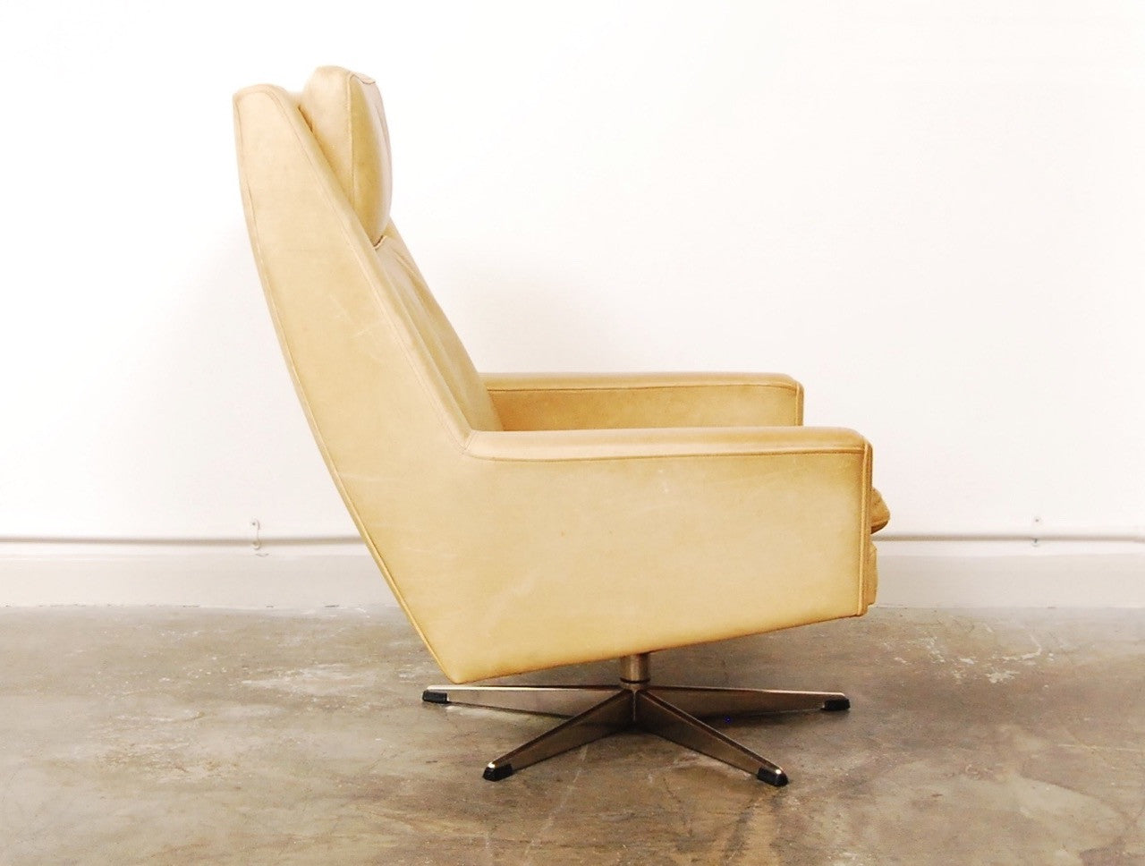 High back lounger in cream leather