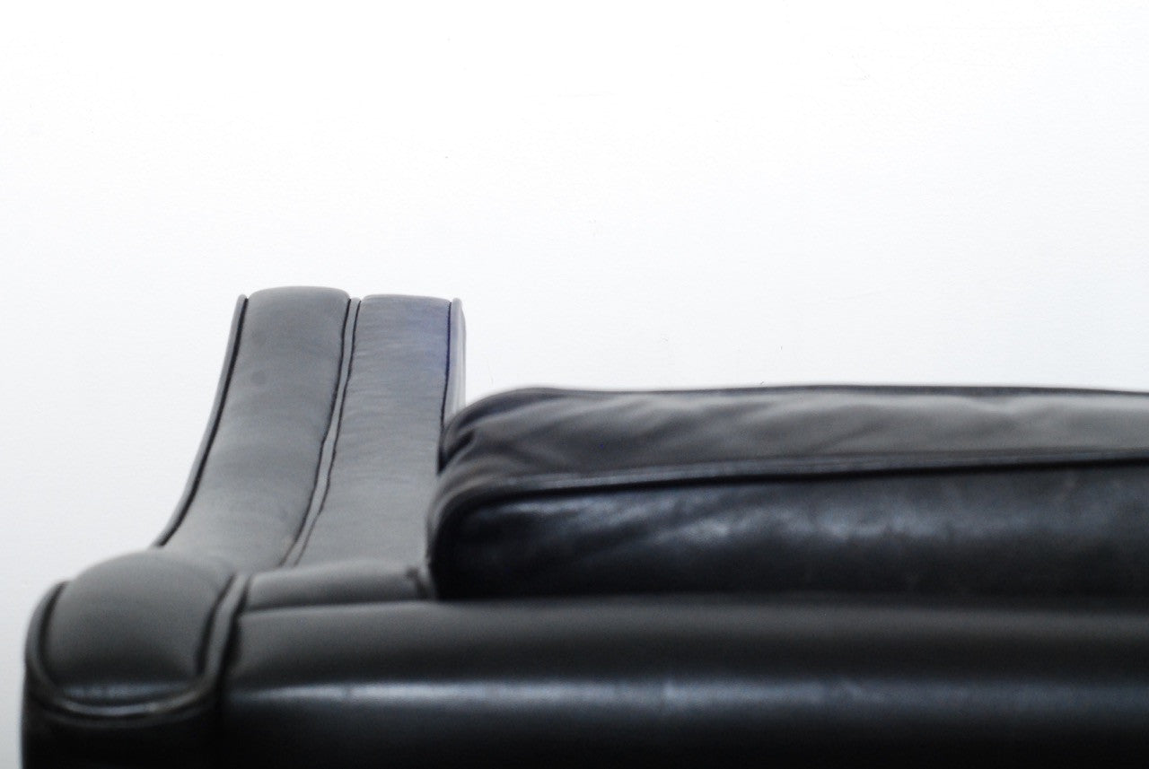 Two seat black leather sofa