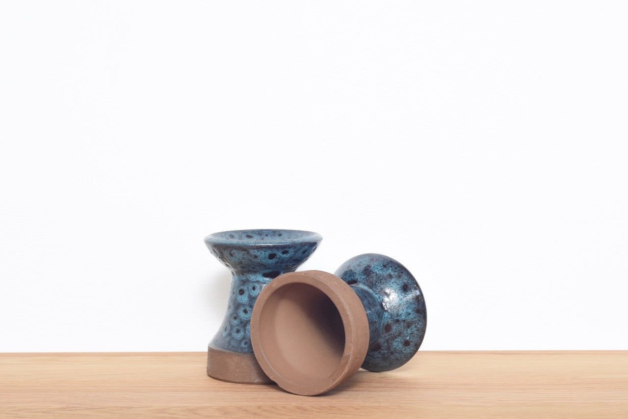 Pair of stoneware candle holders with blue glaze