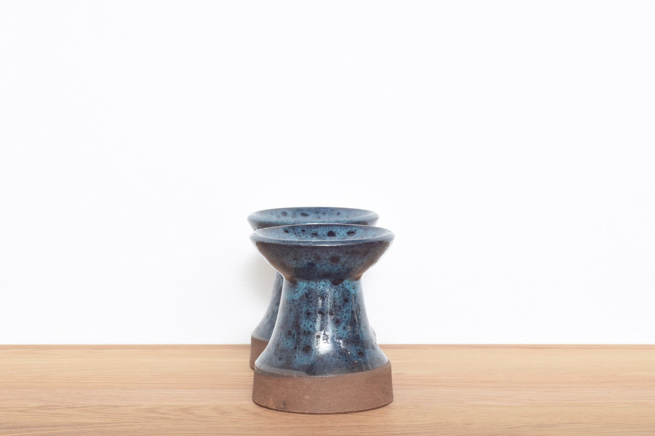 Pair of stoneware candle holders with blue glaze