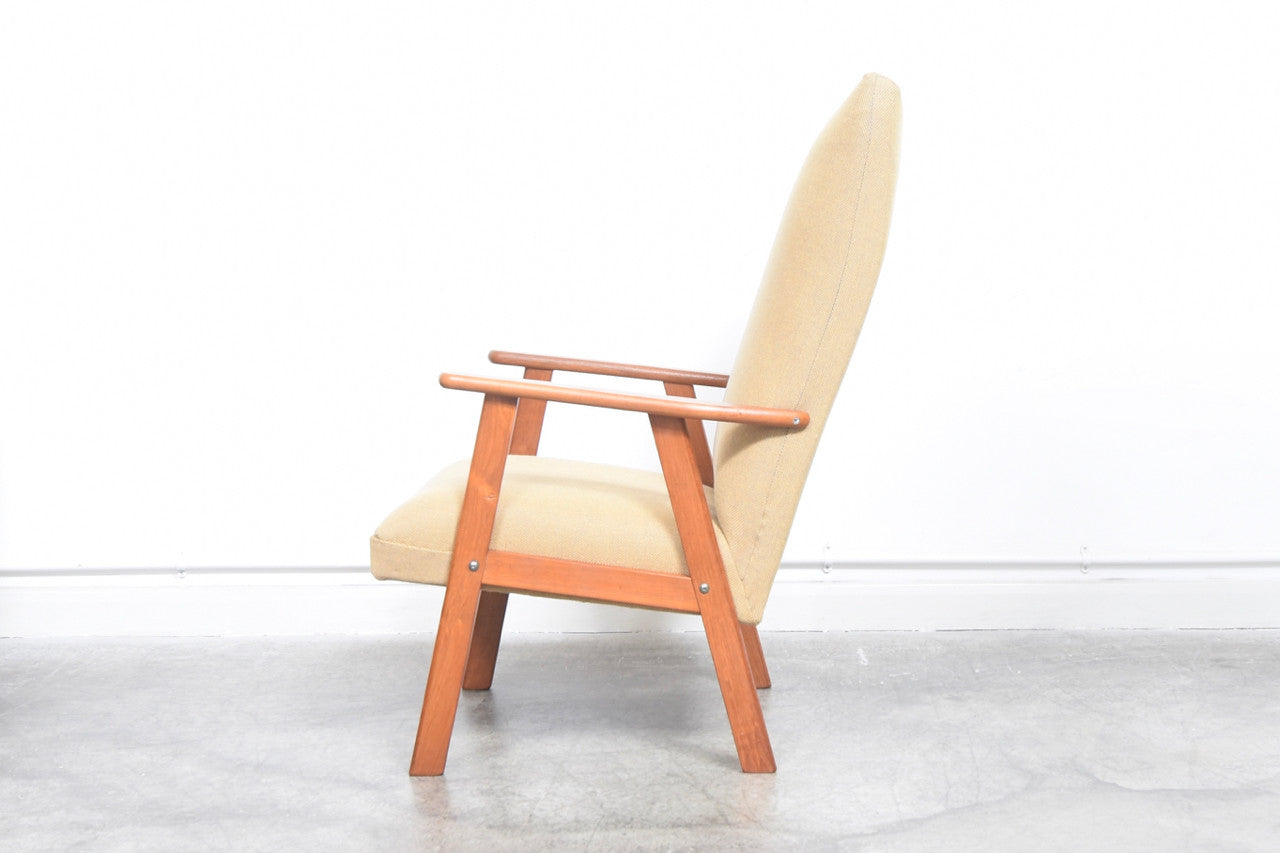 High back lounge chair with a teak frame