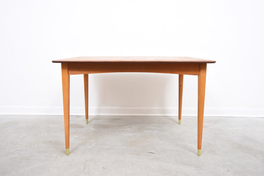 Extending teak dining table on beech legs