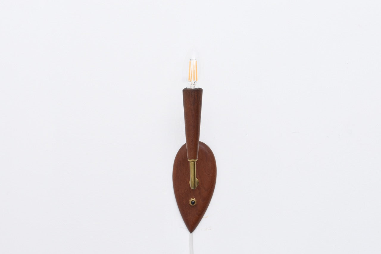 Teak wall light with brass detail