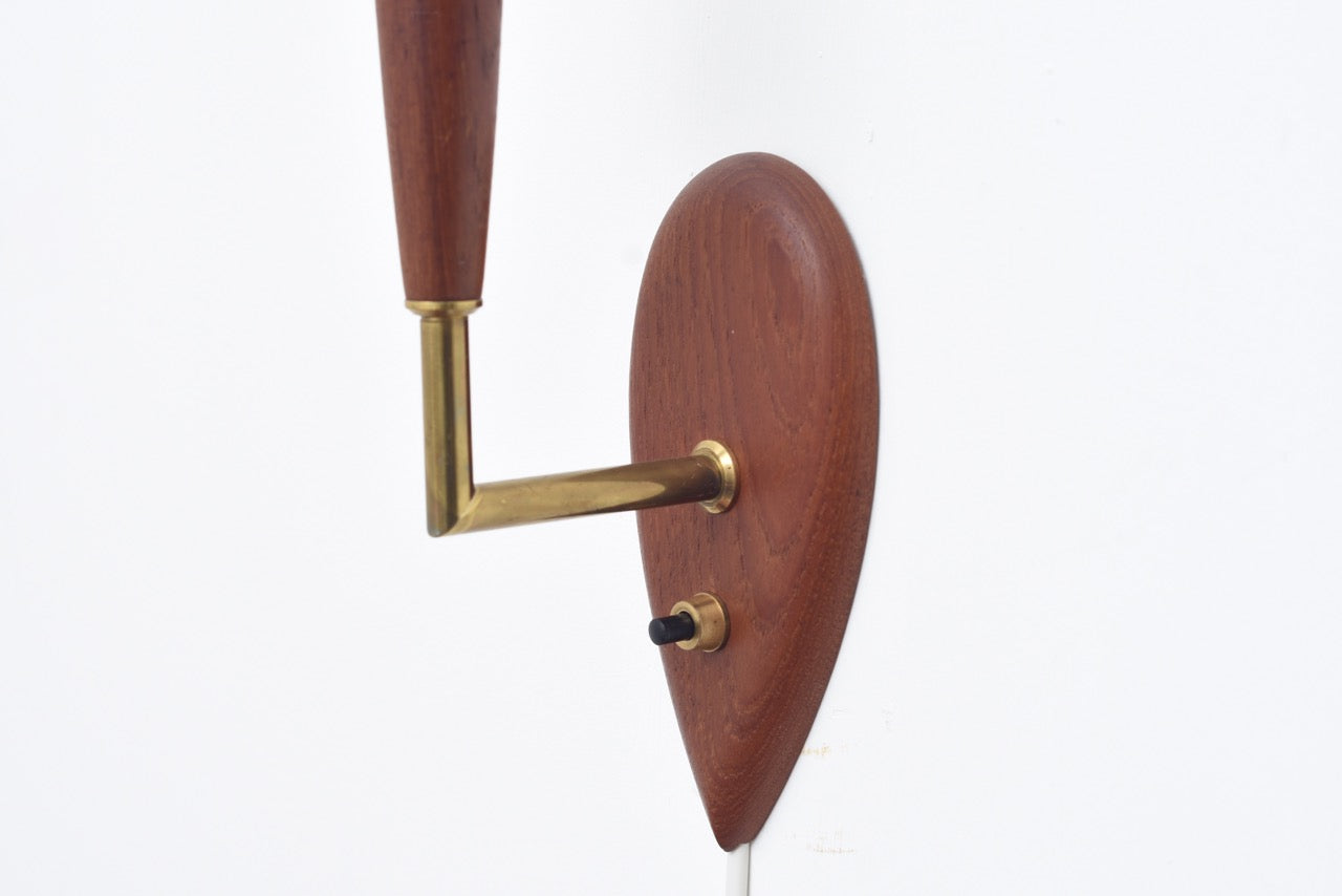 Teak wall light with brass detail