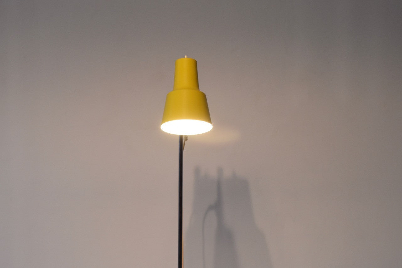 Floor lamp with yellow shade