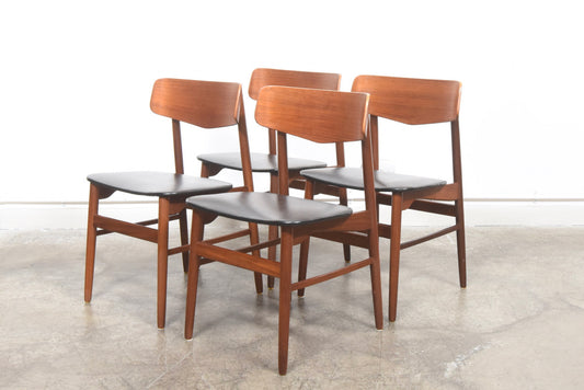 Set of four teak dining chairs