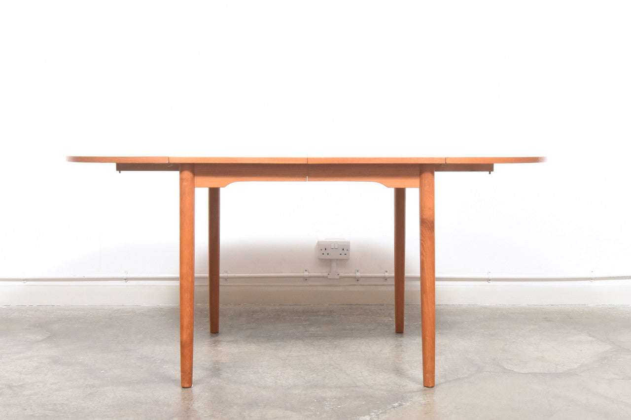 Extending dining table with removable drop leaves