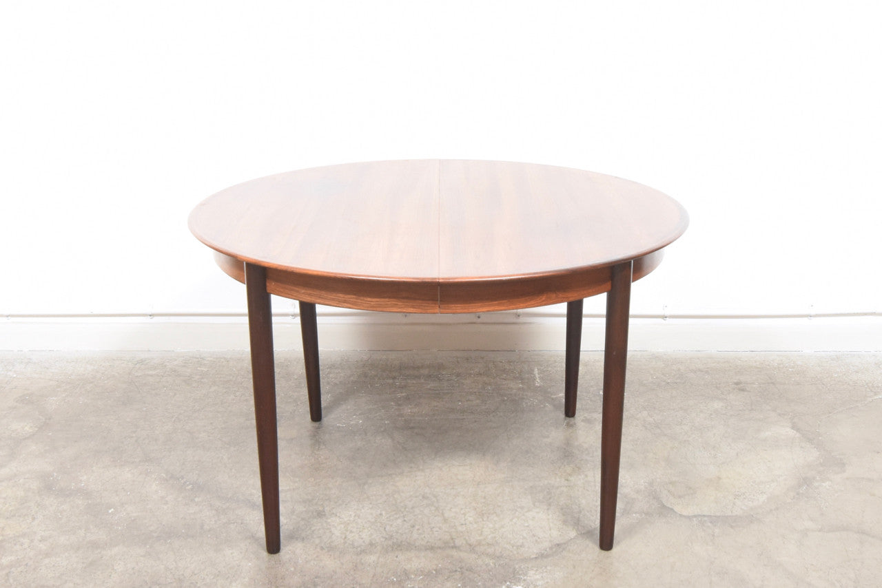 Extending rosewood dining table by Skovby