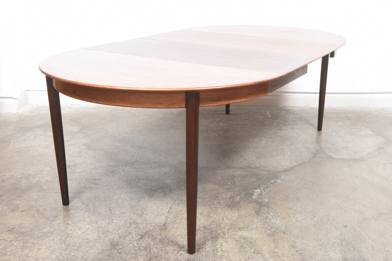 Extending rosewood dining table by Skovby