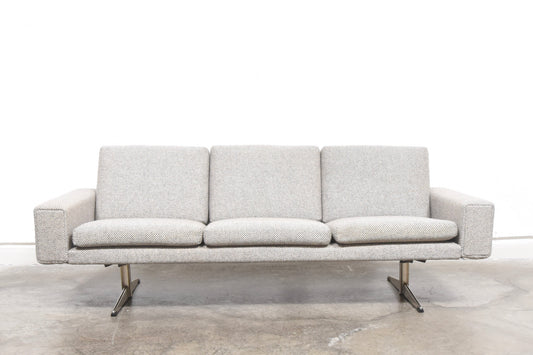Grey wool sofa on shaker legs