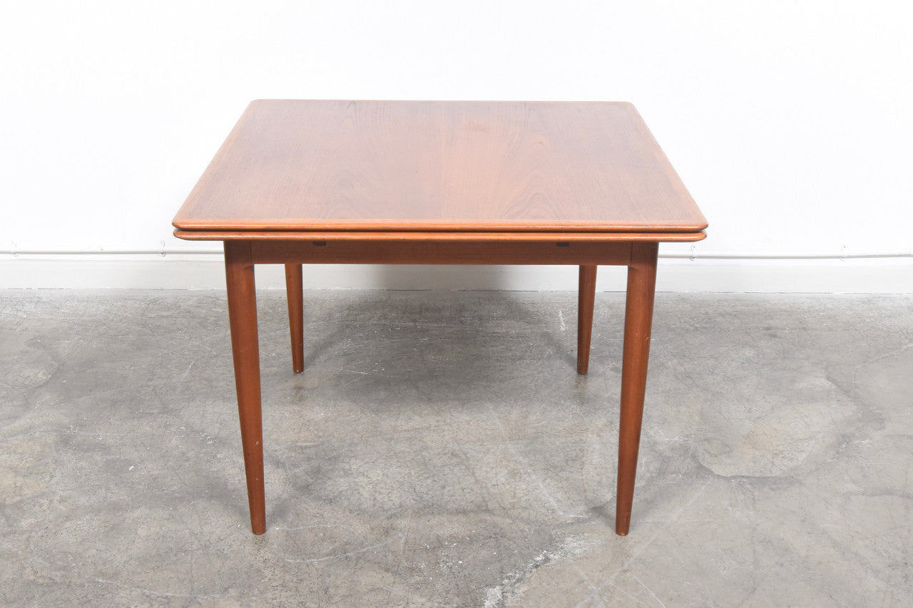 Extending square dining table in teak