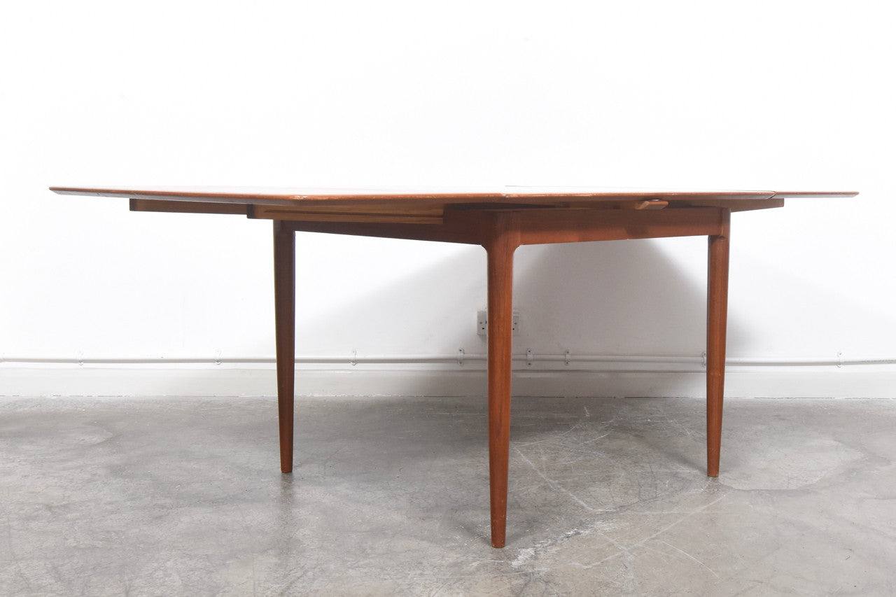 Extending square dining table in teak